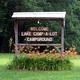 Entrance/welcome sign for 'Lake Camp-A-Lot' at a landscaped area — clearly identifies the property and useful for gallery; image is on the About page.