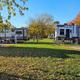 Close perspective of several RV sites with gravel pads, hookups and fall foliage — illustrates individual campsite appearance and surroundings (on the site’s photo pages).