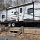 Clear, high-resolution photo of an RV at a gravel campsite showing site features (steps, picnic table, site layout). Source: Services page social image — good representation of full-hookup RV sites on the property.