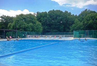 Resort swimming pool with deck and fencing — a key guest facility shown on the property page and useful for the gallery.