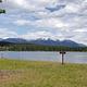 View from swim beach at Seeley Lake Campground, looking east across Seeley Lake. Snow-capped peaks of the Swan Range can be seen in the background. 