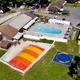 Swimming pool and recreation overview at Ramblin’ Pines Campground