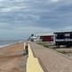 Sea wall and cabins