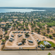 High-altitude aerial view showing the entire RV park layout with parked RVs and Lake Buchanan in the background — useful for an overview of property location and scale (source homepage aerial image).