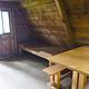 Mount Flemer Cabin interior showing wood table and bed