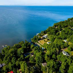 Arial shot of Mille Lacs Lake and rental cabins at the Red Door Resort.