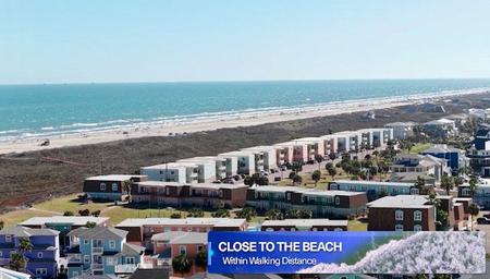Coastal/aerial view demonstrating close walking distance to the beach and nearby accommodations — supports the property's beach-proximity claim on the site.