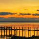 Fishing pier at sunset at Coastline RV Resort