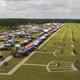 Aerial/overview photo of the trapshooting grounds showing multiple shooting stations, parking, tents, and the long range layout — clearly depicts the property layout and event setup (from the site homepage).