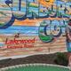 18‑hole mini golf image with Lakewood branding mural in the background — a distinct on‑site activity shown on the Amenities page.