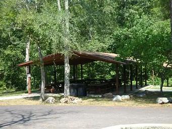 Group Shelter showing picnic tables and grills