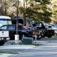 Close view of an RV row and parking pads with utility pedestals and guests' vehicles — useful detail of site setup; from the park homepage images.