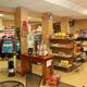 Interior view of the camp store/office showing shelving and convenience items — depicts on-site facilities and is from the site’s amenities page.