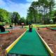 Miniature golf course lanes and playground beyond — an on-site recreational facility pictured on the property gallery, useful to show activities available.