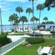 Elevated view of RV sites, grassy area and waterfront with docks — useful overview showing RV pitches and layout near the water (site homepage/gallery).