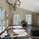 Interior living space with large windows and natural branch ceiling element — demonstrates the style and interior environment of a Seguin tree dwelling unit.