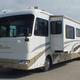 Clear frontal view of a Phaeton motorhome with slide-outs parked on the company lot; image is from the site homepage showing the rental fleet and lot context (page: Motorhome Rentals and Service Center in the New Orleans area).