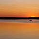 A lone boat out fishing on Lake Oahe at sunset at Hazelton Recreation Area