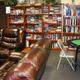 Community library/lounge with shelving and seating — shows indoor common-area amenities available to guests (source page: Amenities).
