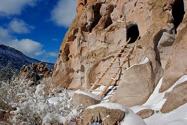 Wooden ladder leading up to a cave