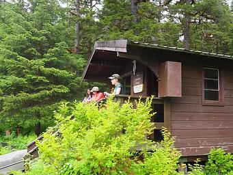 Visitors on the porch of Anan Lake Cabin