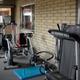 Indoor fitness equipment in a dedicated room with windows overlooking the grounds — represents the campground’s fitness amenity (source page: Amenities).
