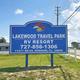 Large entrance sign for 'Lakewood Travel Park RV Resort' — clear property identity and street-facing entrance, matches page header image on the property page.