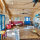 Interior view of the clubhouse/common room with seating and décor — demonstrates indoor guest facilities and the style of the resort's shared spaces (homepage interior photograph).