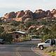 Campground road lined with campsites and boulders in the background.