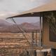 Canvas luxury safari tent with views of the Christmas Mountains at Camp Elena in Terlingua, Texas, near Big Bend National Park.
