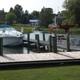 Marina/dock view with boats moored and a wooden dock — demonstrates waterfront access and recreational boating facilities referenced on the activities page.