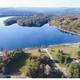 Aerial view of lakeshore with winding road