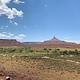 Panoramic view of the desert campground with a ribbon of cottonwood trees 