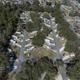 High overhead drone shot showing the full layout of RV pads, roads and trees — good site overview. Source: homepage/gallery drone images on the park site (clearly labeled and same park).