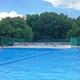 Resort swimming pool with deck and fencing — a key guest facility shown on the property page and useful for the gallery.