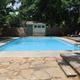 On-site swimming pool with deck and seating — useful facility photo showing guest amenities and layout (from the gallery page).