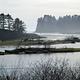 The mouth of the Quillayute River at Rialto Beach. Large sea stacks rise just offshore.