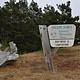 Weathered wooden sign in front of shore pine trees that says "OREGON DUNES National Recreation Area DRIFTWOOD II CAMPGROUND.
