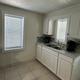 Kitchen interior of a rental unit (sink, cabinets, counter) — documents indoor facilities available in the campground's rental accommodations.