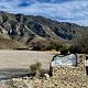 Entry sign to the Frijole Ranch area with view of the mountains in the background and the Frijole Horse Corral campground.