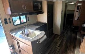 Camper with a queen living space and a bunkhouse.