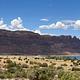 Overview of Ken's Lake Campground with red rock cliffs lining the horizon.