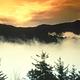 A dramatic colored evening sky above peaks in the Smokies