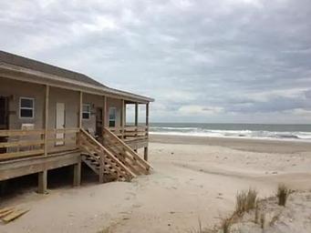 Long Point Cabin Camp with beach in the background