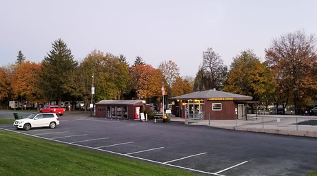 View of the office/entrance area and parking from a small hill — useful for showing park entrance and amenities (image found on the site's About page).