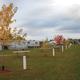Clear photo of seasonal/daily RV/campsite row with hookups, picnic tables and numbered pedestals — highlights campsite amenities and spacing (from Daily/Seasonal Campsites page).