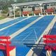 Outdoor courts (shuffleboard or similar) with seating and covered benches — depicts on‑site recreational facilities. Image appears on the homepage and matches other site amenity photos.