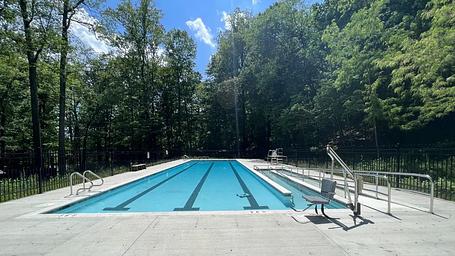 The fenced, outdoor swimming pool at Camp Misty Mount is a big hit during hot summer days