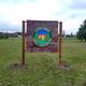 Photograph of the campground entrance sign installed on the property — useful for identification and arrival orientation. Shown on the home page.