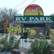 Photograph of the park entrance sign and landscaped frontage — useful for guests to identify the property and entrance (Facilities page).